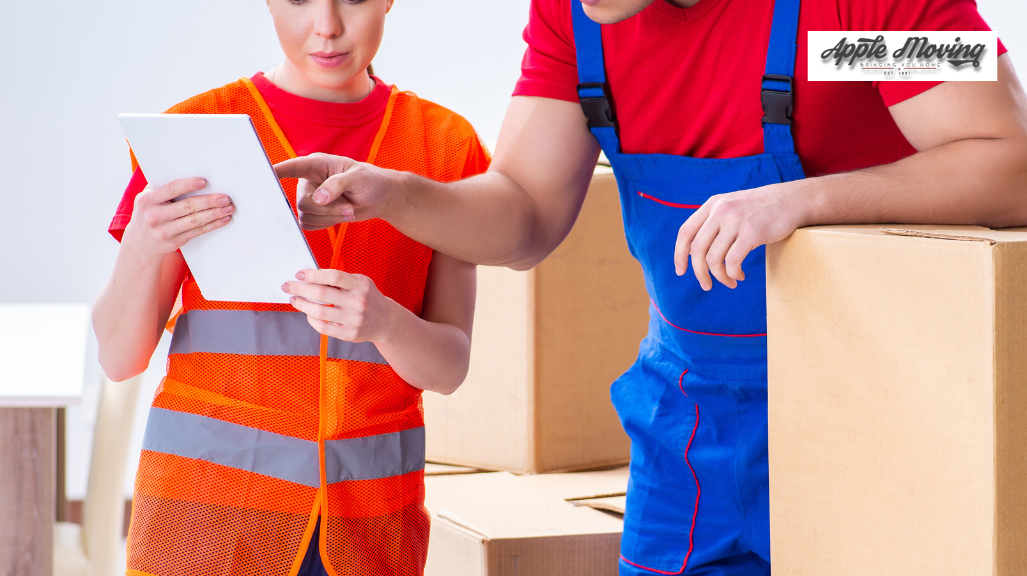 man pointing out on a piece of paper white leaning on a box